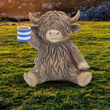 Highland Cow Holding a Cuppa